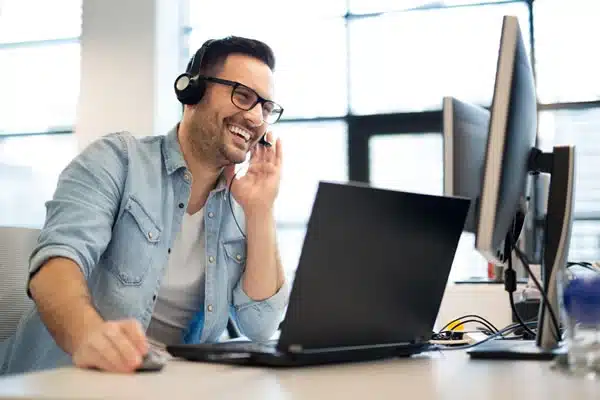 man-at-workstation-with-headset
